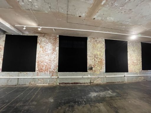 Custom made blackout drapes installed for an event in London, providing full light control and a clean backdrop