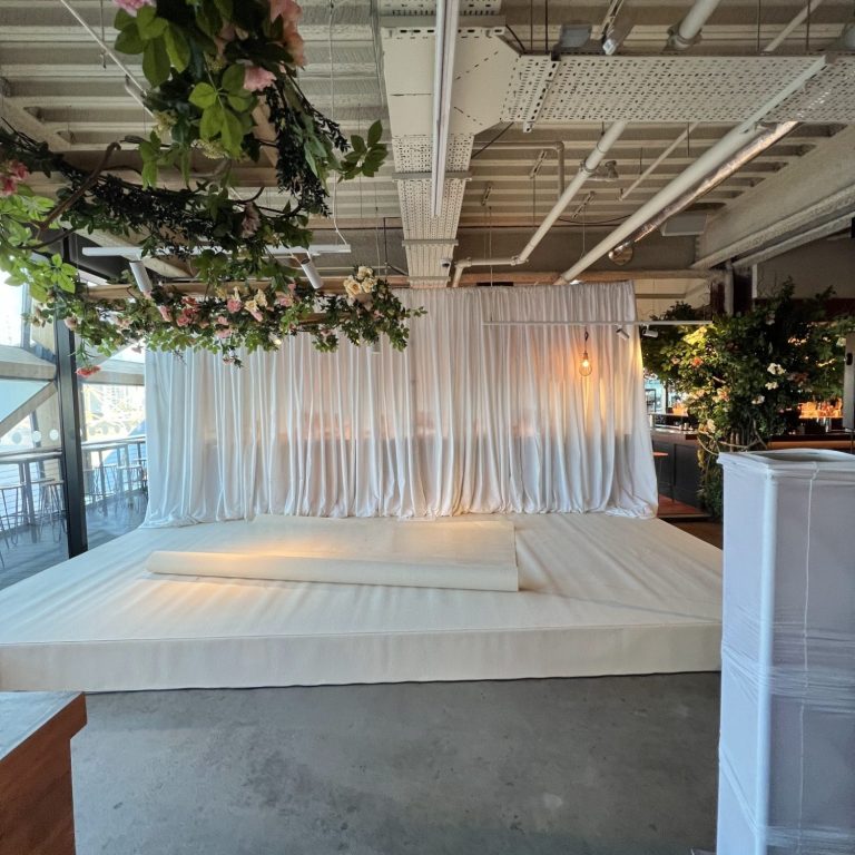 burgundy velvet draped entrance for a London corporate event