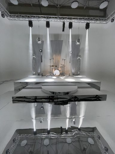 Silver stage drapes installed for a video shoot in London, creating a clean backdrop for filming