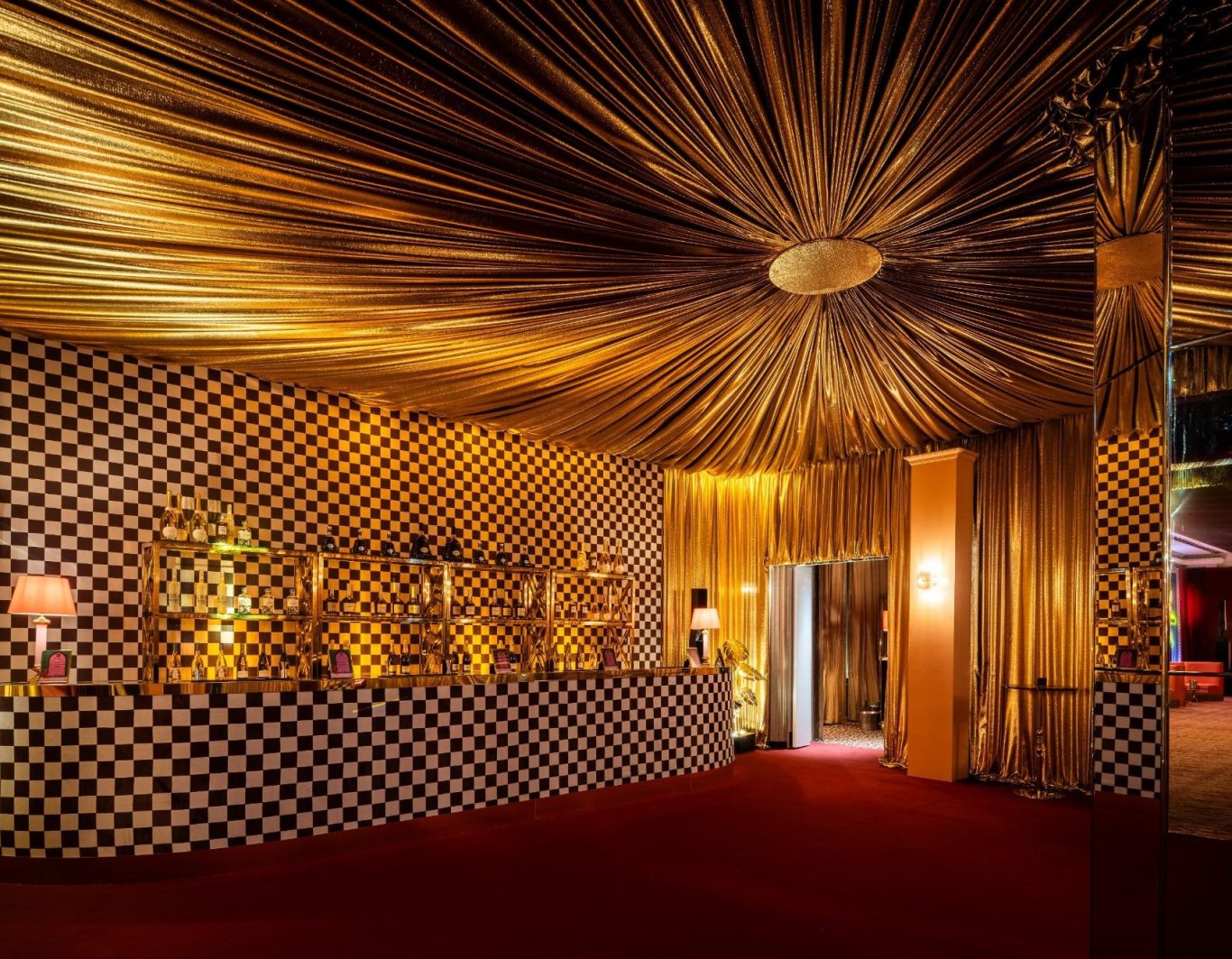 Gold lame drapes London gold lame drape installation at Claridges hotel, London
