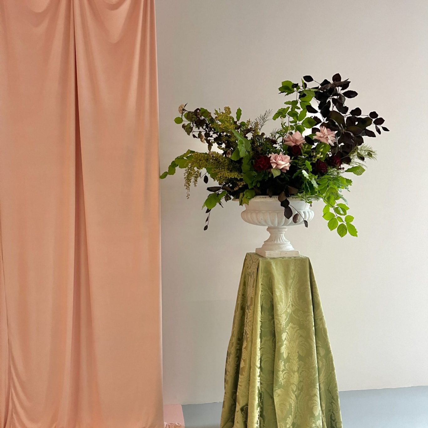 soft pink drapes installed within a London art gallery