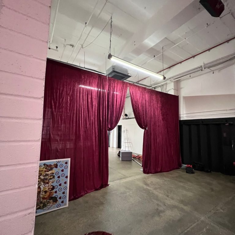 burgundy velvet draped entrance for a London corporate event