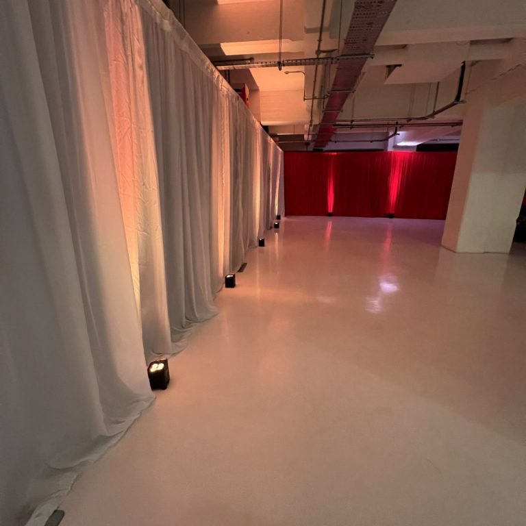 Green Velvet Wedding Drapes London – Backdrop Installation Green velvet wedding drapes in London creating a rich backdrop using freestanding pipe and drape system