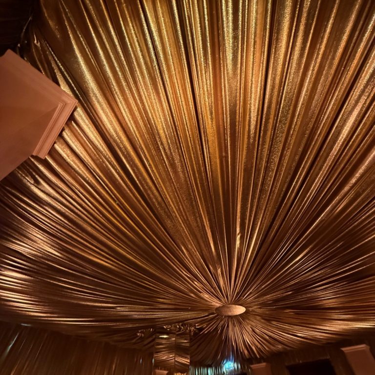 gold lame drape installed for Brots afterparty